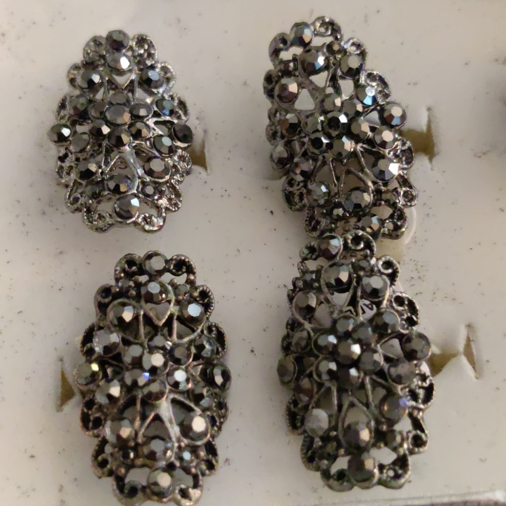 1 Silver rhinestone statement ring.  $1 with purchase of another item in closet.